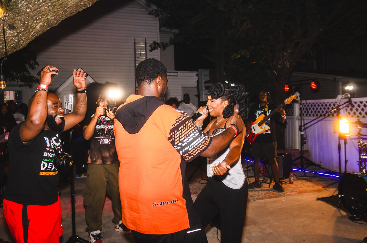 Guests enjoying a live performance at DMV Backyard Jam